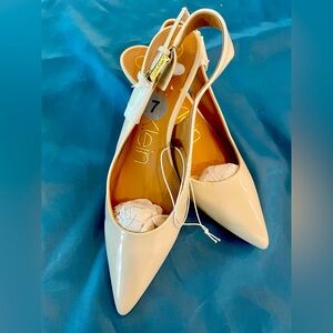 Ivory patent leather Calvin Klein kitten heel sandals (size 7).